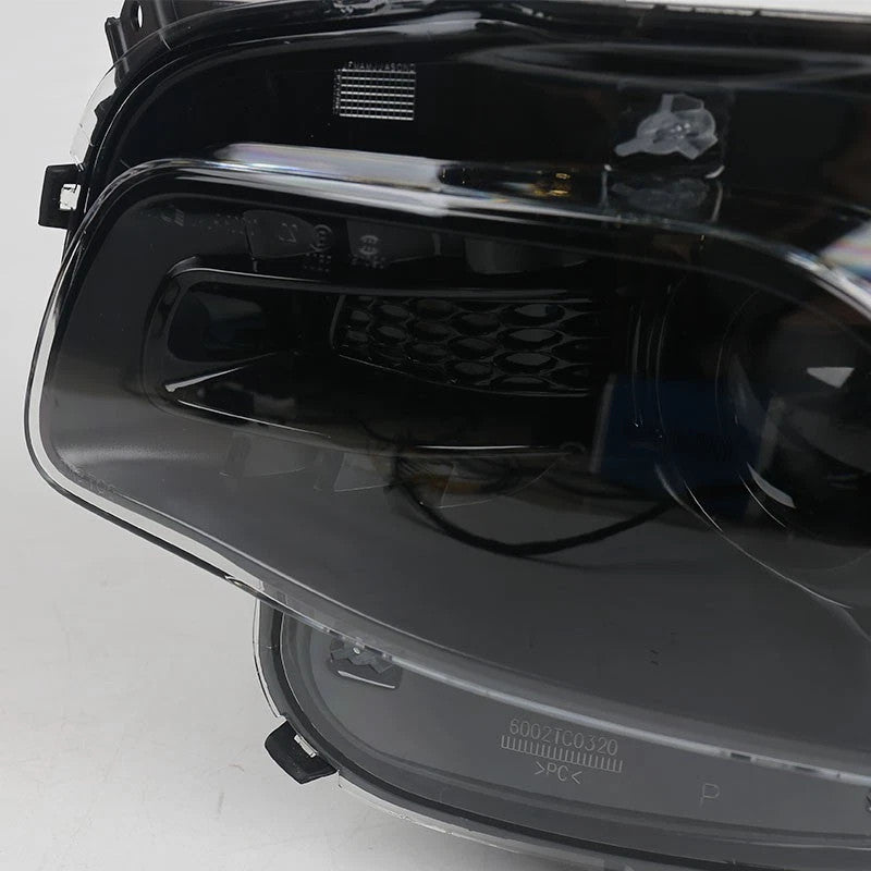 Hid headlight DOT marking close-up for 2014-2018 Jeep Cherokee