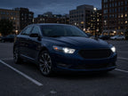 2013-2019 Ford Taurus with black HID projector headlights installed